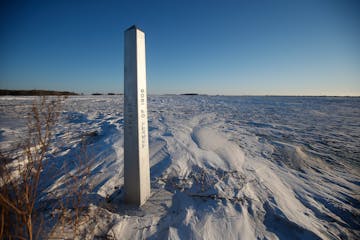 FILE - A border marker, between the United States and Canada is shown just outside of Emerson, Manitoba, on Jan. 20, 2022.