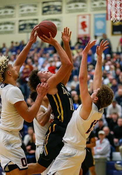 DeLaSalle's Gabe Kalscheur was fouled on his way to the basket. Kalscheur scored 18 points in the first half of a 35-35 tie with Orono. Class 3A Secti