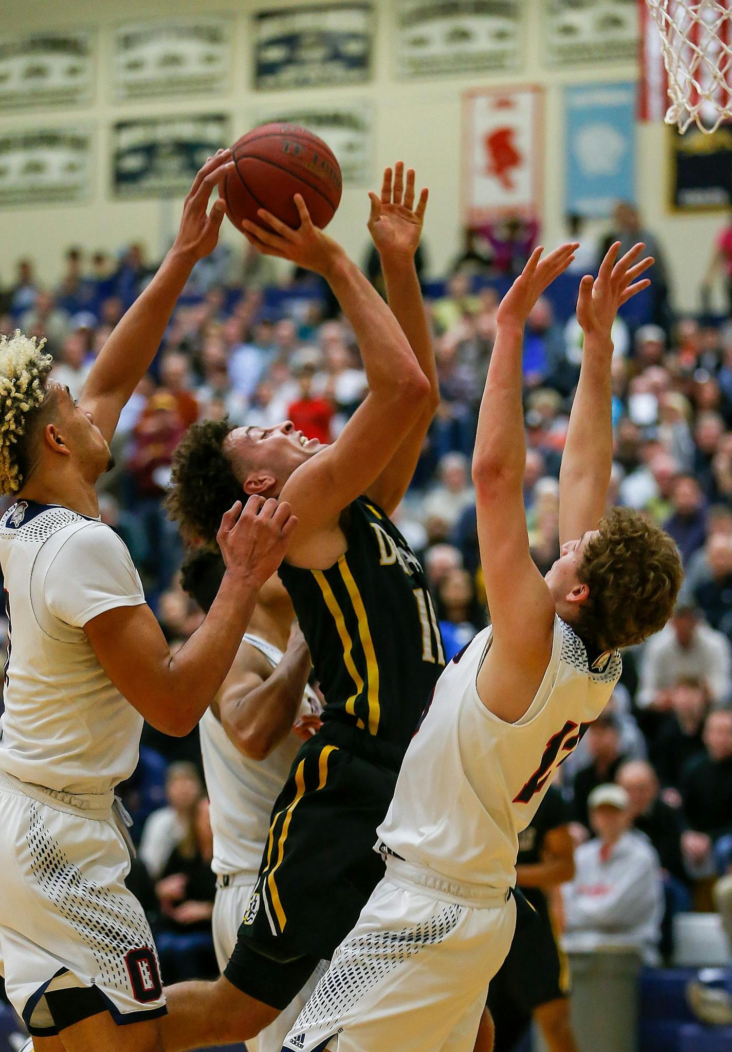 DeLaSalle's Gabe Kalscheur was fouled on his way to the basket. Kalscheur scored 18 points in the first half of a 35-35 tie with Orono. Class 3A Section 6 boys basketball final: DeLaSalle vs. Orono at Chanhassen HS, 3-15-18. Photo by Mark Hvidsten, SportsEngine