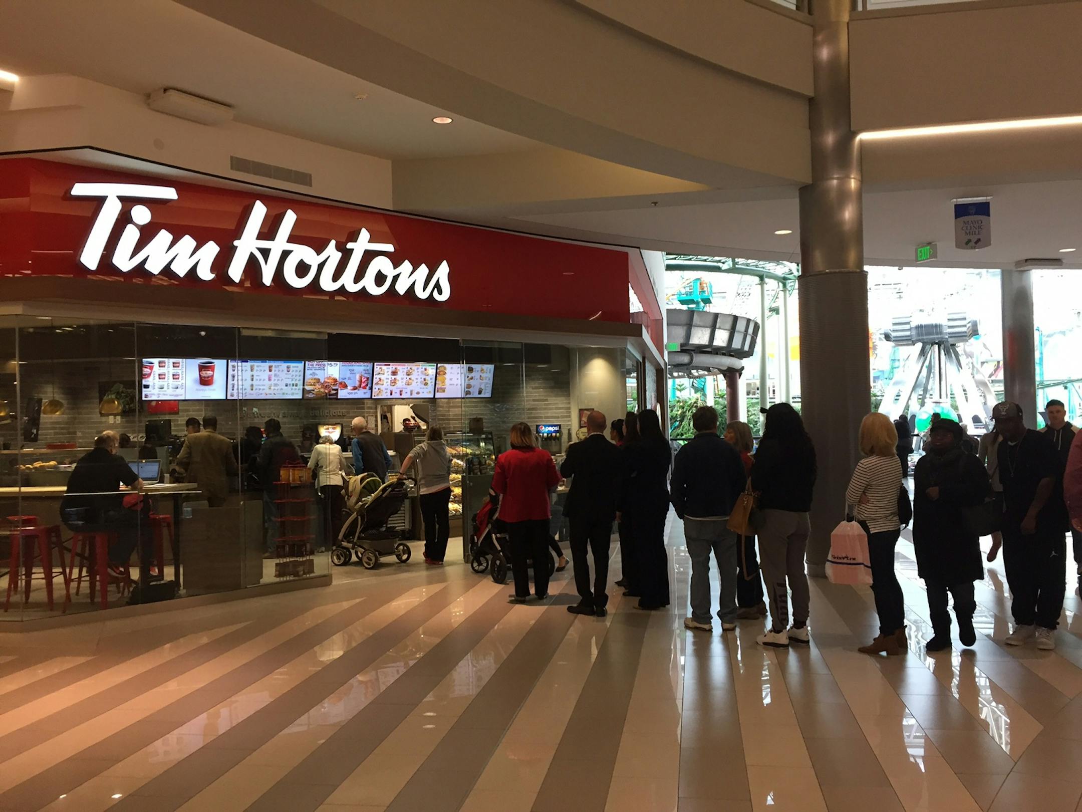 A line of customers goes out the door during the soft opening last month of the new Tim Hortons at Mall of America.