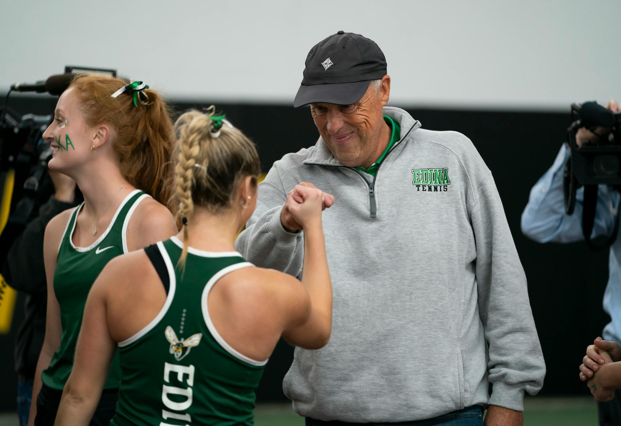Edina coach Steve Paulsen fist-bumped Nicole Copeland after the Hornets won the Class 2A team championship on Wednesday.