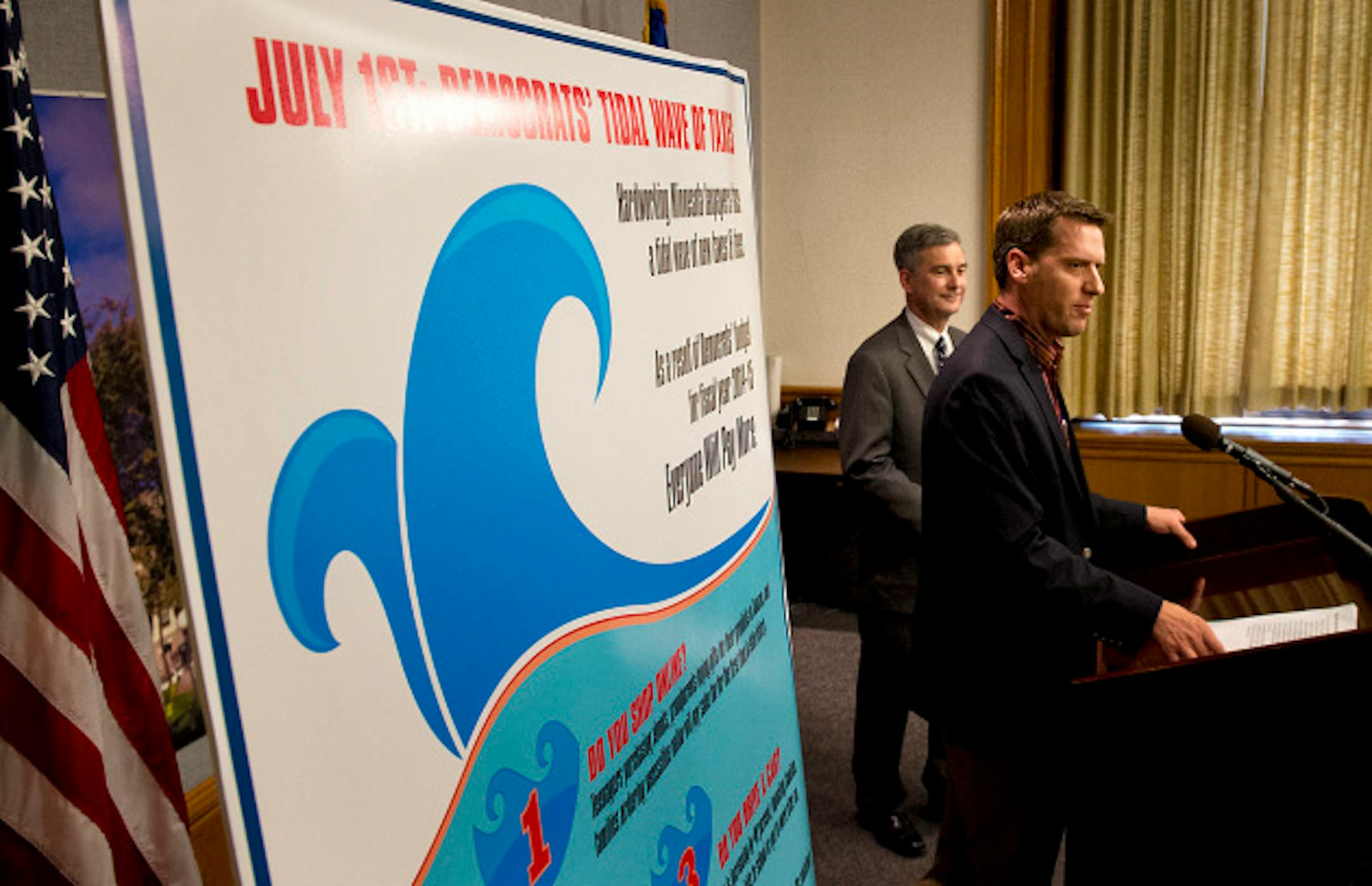 Next to a poster reading July 1st, Democrats tidal wave of taxes, Senate Republican Leader David Hann and House Republican Leader Kurt Daudt discussed the impact of new taxes imposed by the democrats on Monday, July 1, 2013, the first day of the new biennium.  GLEN STUBBE * gstubbe@startribune.com