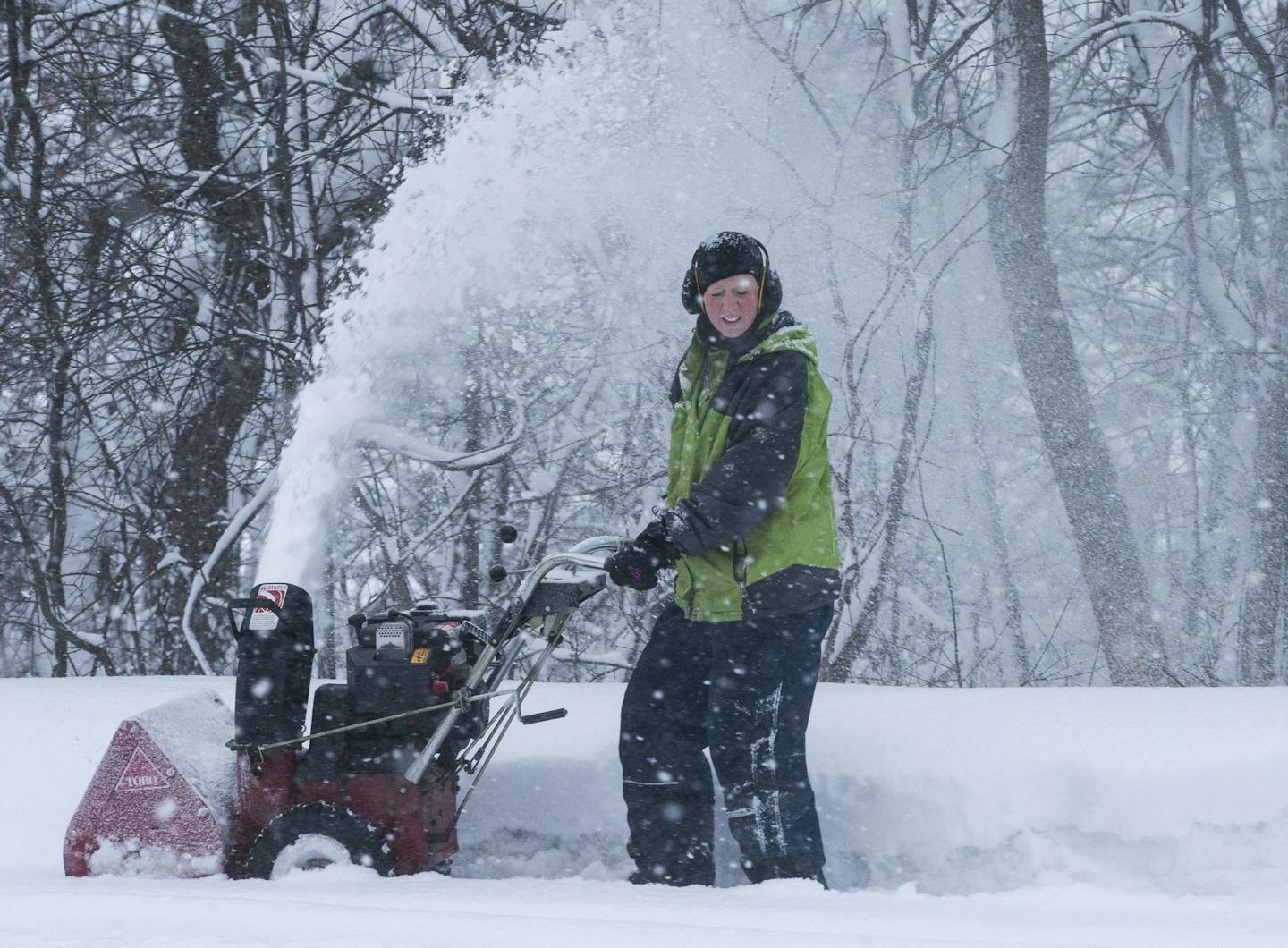 Dee Smith used a snow blower to clear her the road in front of her house (which is usually last to be plowed) during a snow storm on Tuesday, February 2, 2016 in Burnsville, Minn. ] RENEE JONES SCHNEIDER &#x2022; reneejones@startribune.com