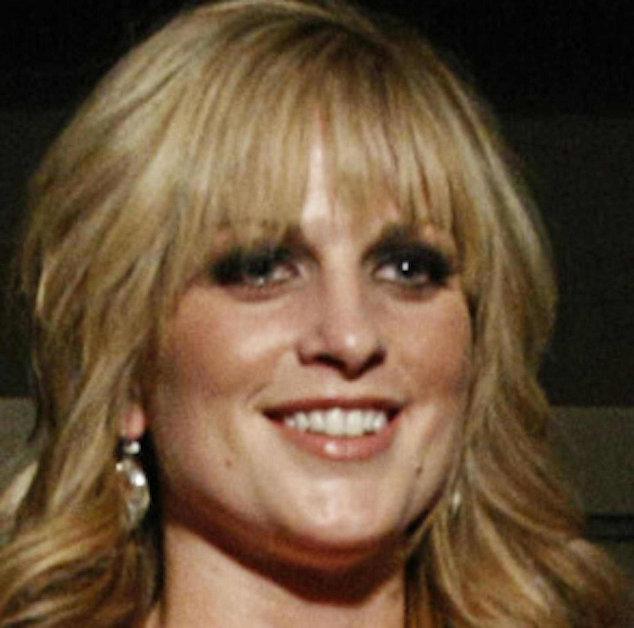 WCCO-TV Morning News Anchor Jamie Yuccas strikes a pose on the runway wearing a dress designed by Laura Fulk during the Red Dress Collection fashion show at the Graves 601 hotel on Sunday, February 16. ] Chris Kelleher, Special to the Star Tribune, 2/16/2014, Minneapolis, Minn. EXTRA INFO: 20033102A_REDDRESS022014