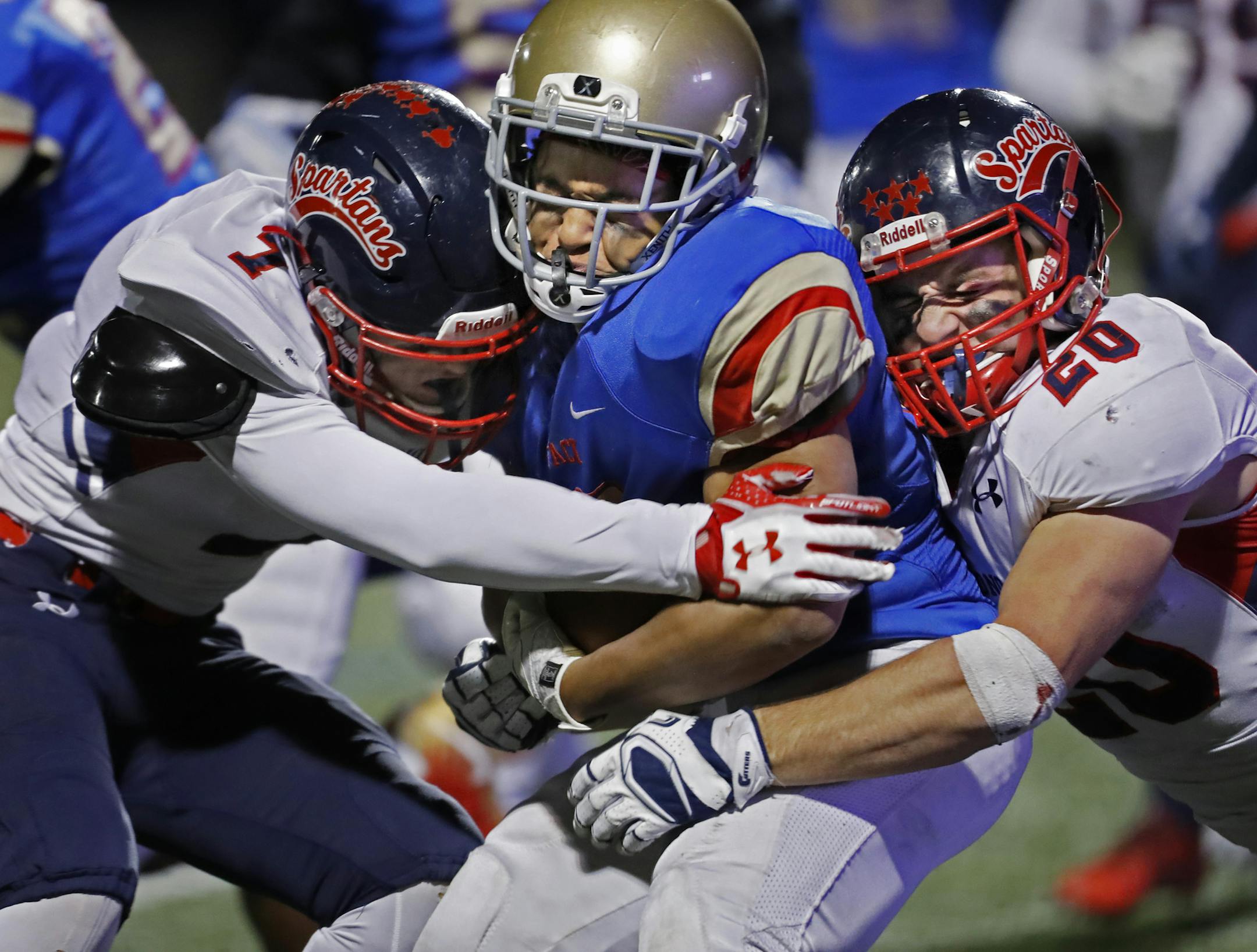 SMB RB THOMAS WASHINGTON(33) gets wrapped up by Grant Perry(7) and Taylor Reeves(20).]SMB face off against Orono in the playoffs.Richard Tsong-Taatarii/Richard.tsong-taatarii@startribune.com