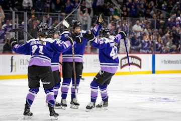 Teammates celebrate with Frost defenseman Lee Stecklein (2) after she scored to tie the game in the second period.