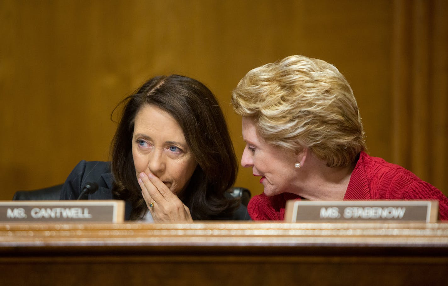 Sens. Maria Cantwell (D-Wash.), left, and Debbie Stabenow (D-Mich.) confer during a Senate Finance Committee hearing to examine the Children's Health Insurance Program on Capitol Hill in Washington, Sept. 7, 2017. (Allison Shelley/The New York Times) ORG XMIT: MIN2017091813201515