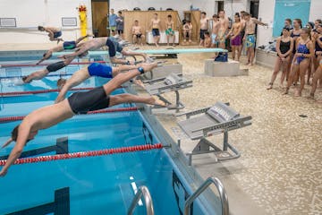 Dassel-Cokato High School students begin the swim portion of a triathlon at the school in Cokato, Minn., on Thursday, May 22, 2025. Students at the sc