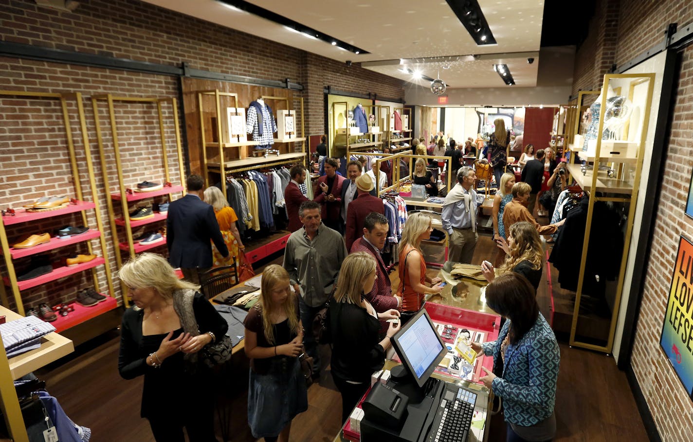 Shoppers looked through the new Moods of Norway store in the Mall of America during the grand opening on Thursday. ] CARLOS GONZALEZ cgonzalez@startribune.com September 5, 2013, Bloomington, Minn., Mall of America store opening - Moods of Norway , MOA, ribbon cutting of the new store at 6:30 p.m. and the party at Radisson Blu