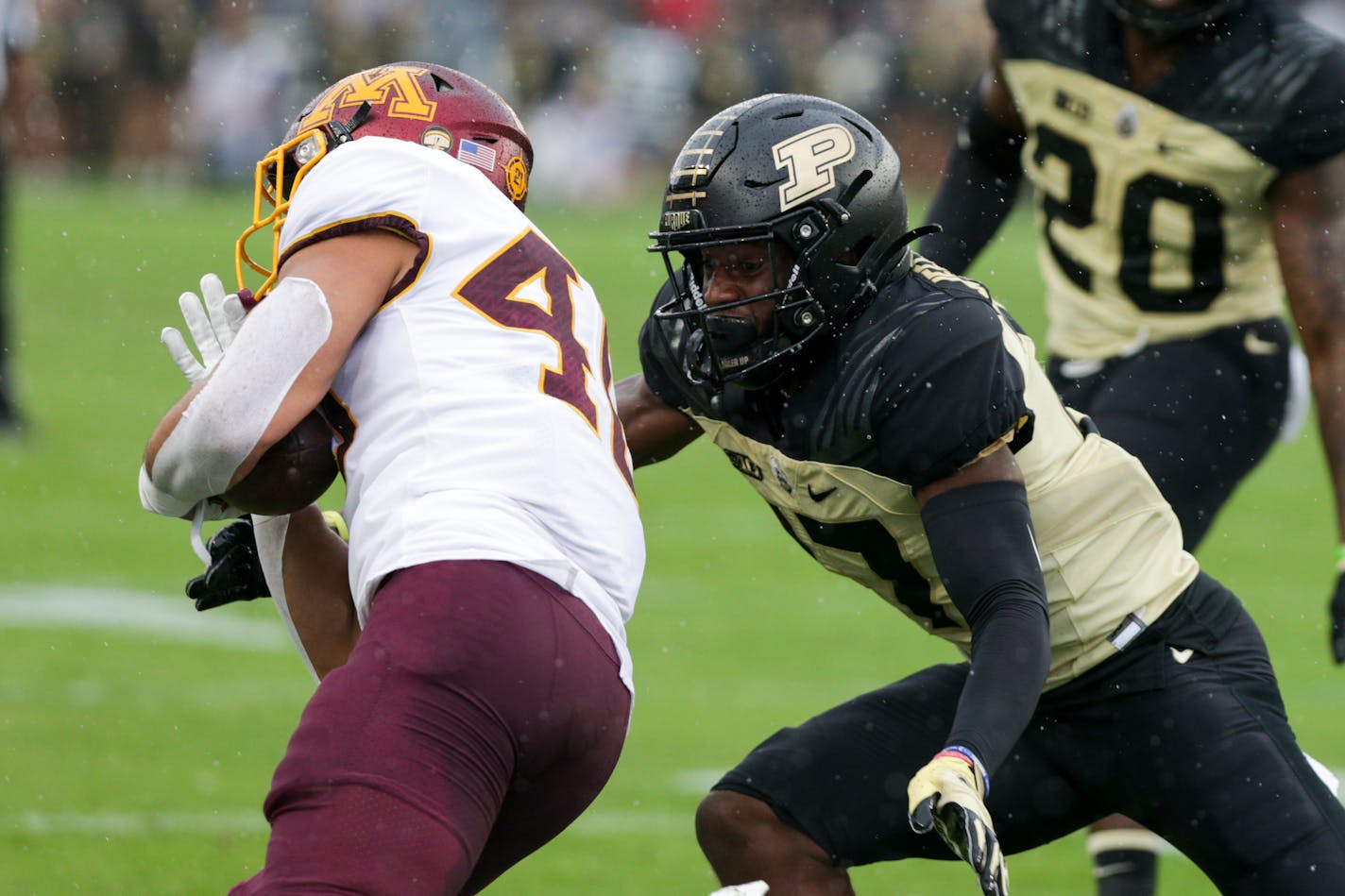 Purdue safety Chris Jefferson (17) tackles Minnesota running back Bryce Williams (40) during the first quarter of an NCAA college football game, Saturday, Oct. 2, 2021, at Ross-Ade Stadium in West Lafayette, Ind. (Nikos Frazier/Journal &amp; Courier via AP)