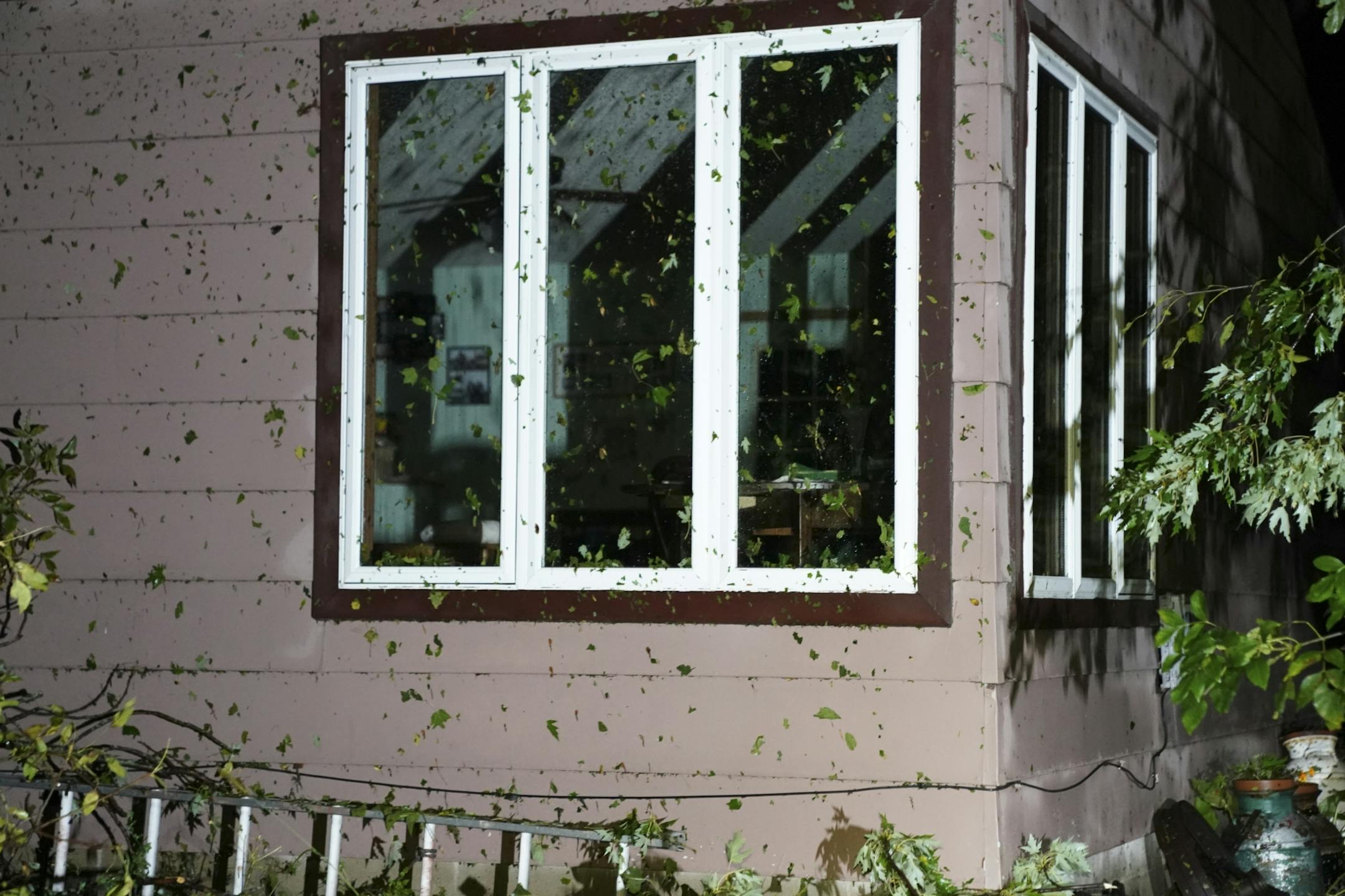 Debris was plastered to the side of a home in Northfield following reports of a tornado in the area earlier Thursday night.
