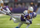 Los Angeles Chargers cornerback Ja'Sir Taylor (36) tackles Minnesota Vikings wide receiver Justin Jefferson (18) to bring him down during the second q