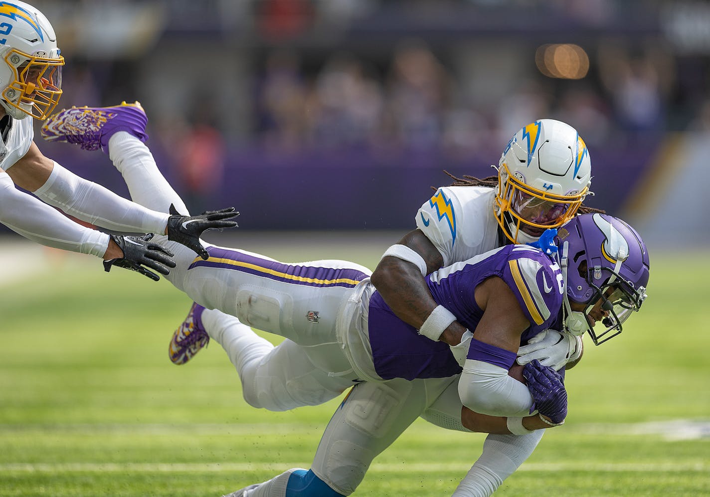 Los Angeles Chargers cornerback Ja'Sir Taylor (36) tackles Minnesota Vikings wide receiver Justin Jefferson (18) to bring him down during the second quarter of the game Sunday, September 24, 2023 in Minneapolis, Minn. The Minnesota Vikings hosted the Los Angeles Chargers at U.S. Bank Stadium. ] Elizabeth Flores • liz.flores@startribune.com