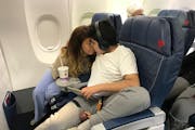 After getting overwhelmed and wanting to get off the plane, Andy Diaz, 13, found a comfortable seat in the first row with his mother, Linda Diaz.