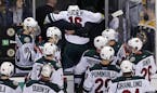 Minnesota Wild left wing Jason Zucker (16) is helped from the ice after an injury in the final seconds of the third period of an NHL hockey game again