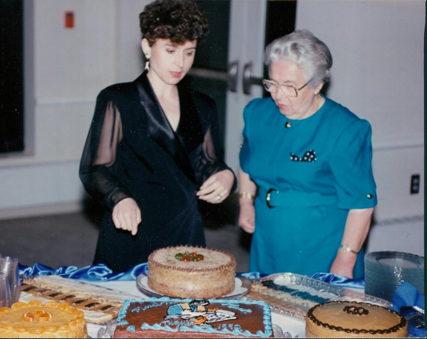 Elena "Ica" Kalina with daughter Eva Moreimi during her grandson's bar mitzvah with some pastries made from "Hidden Recipes."