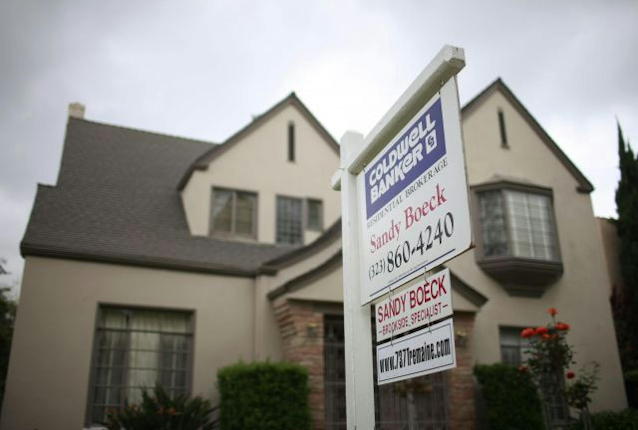 A real estate sign is shown in front of a home for sale in Los Angeles, Tuesday, March 30, 2010. A surprisingly strong rebound in California's real estate market helped lift a key home price index for the eighth month in a row.
