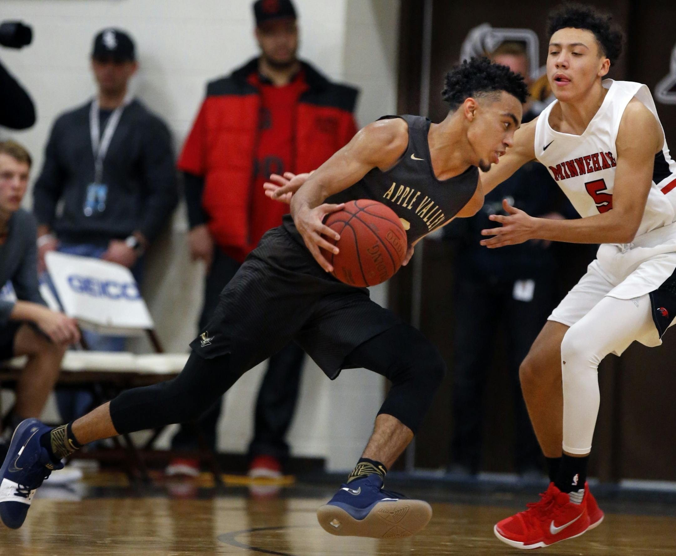 Tre Jones(3) drives on Minnehaha defender Lorenzo Smith(5).