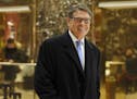 Former Texas Gov. Rick Perry smiles as he leaves Trump Tower, Monday, Dec. 12, 2016, in New York.