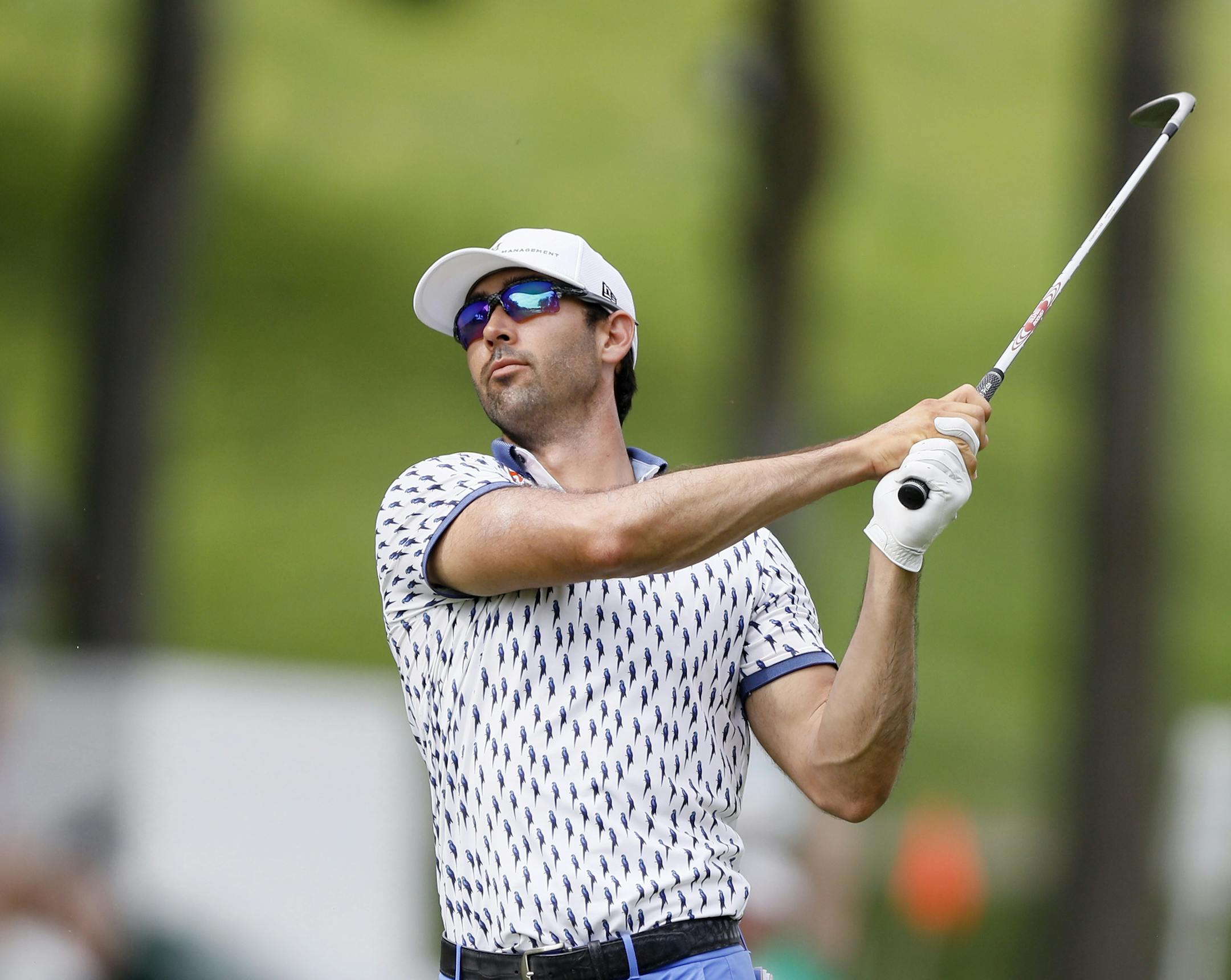 Cameron Tringale hits on the 18th fairway during the third round of the John Deere Classic golf tournament, Saturday, July 13, 2019, at TPC Deere Run in Silvis, Ill. (AP Photo/Charlie Neibergall)