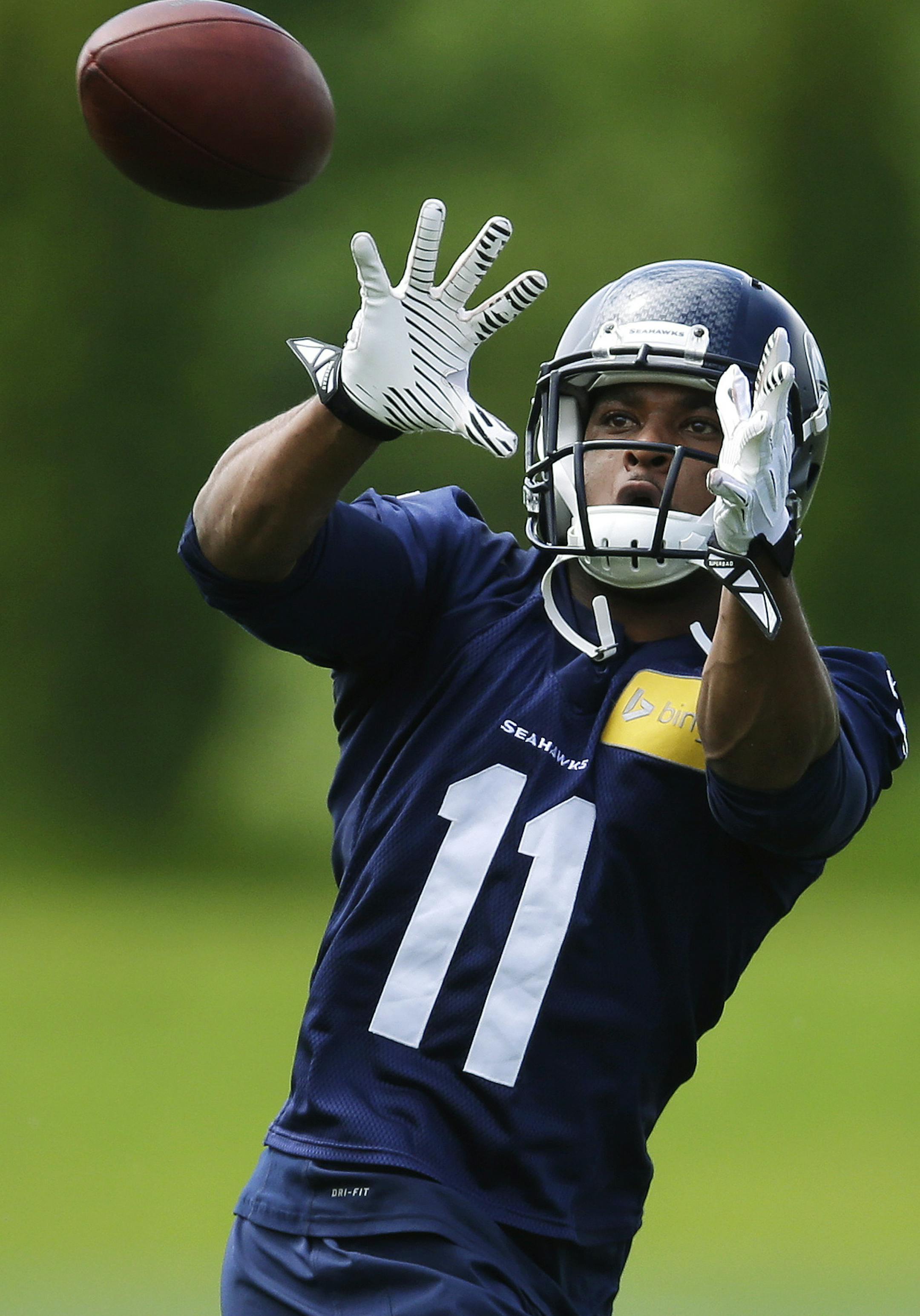 Seattle Seahawks wide receiver Percy Harvin catches a pass during an NFL football organized team activity, Tuesday, May 27, 2014, in Renton, Wash. (AP Photo/Ted S. Warren) ORG XMIT: MIN2014060220485066
