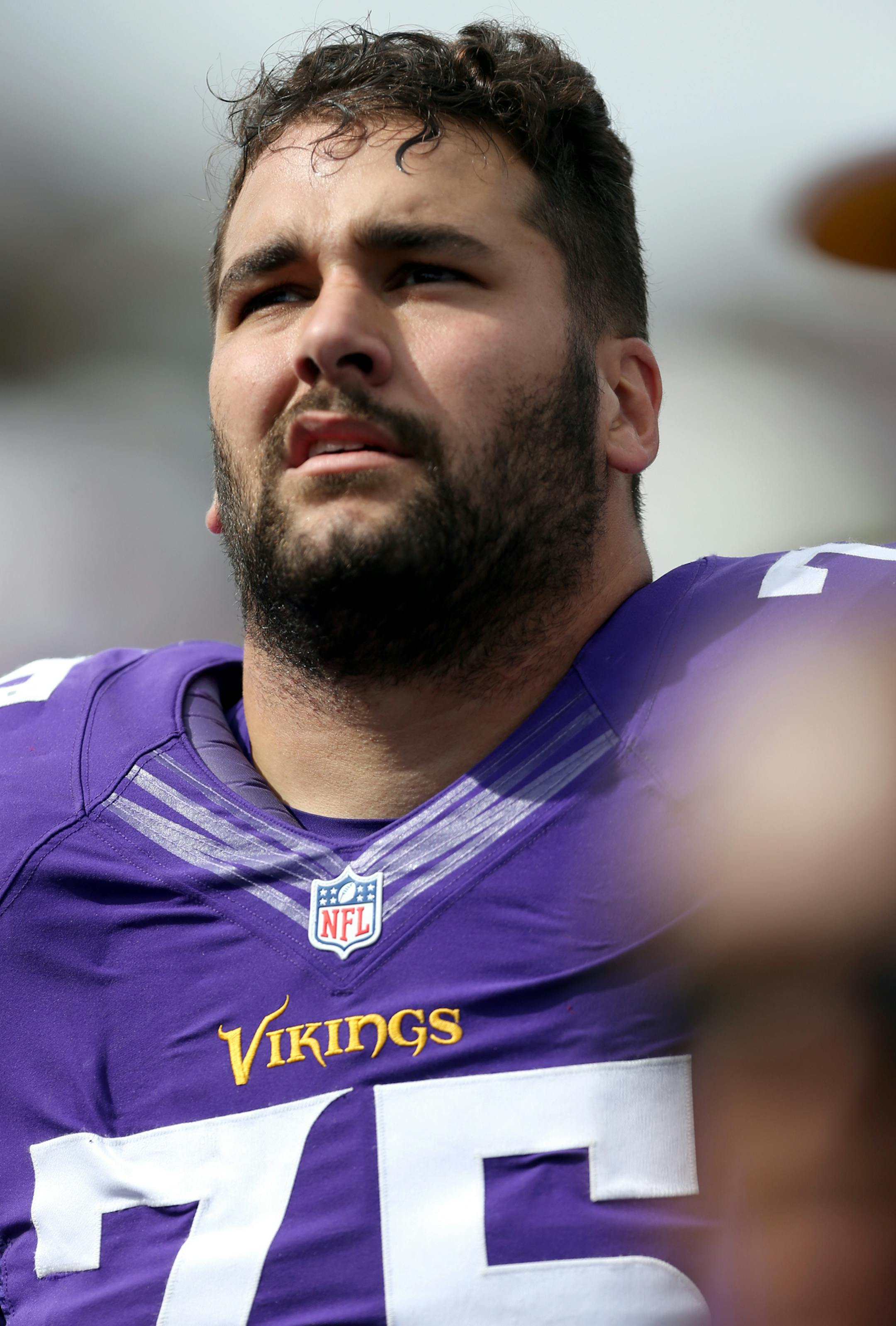 Minnesota Vikings offensive tackle Matt Kalil (75) looks up from the sideline with his helmet off during a NFL football game against the New England Patriots, Sunday, September 14, 2014 in Minneapolis, Minnesota. The Patriots won the game 30-7. (AP Photo/Paul Jasienski) ORG XMIT: PJMN01