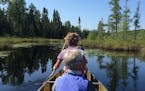 During a BWCA canoe trip in July, Carole Sand of Decorah, Iowa, paddled in the bow with Pat Owen of St. Paul duffing in the middle.