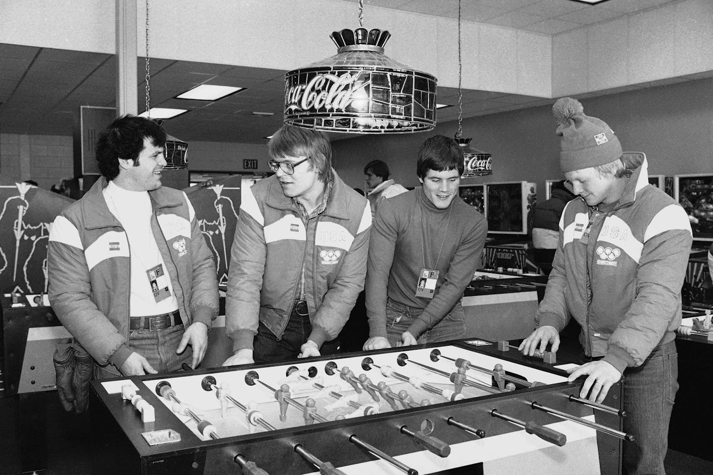 U.S. Olympic Ice Hockey team members (top, L/r) Mike Eurizone, Phil Verchota, John Harrington and Bob Suter have a game of toy soccer in the game room of the Olympic Village on Sunday, Feb. 10, 1980 in Lake Placid, N.Y. Suter died Sept. 9, 2014 in Wisconsin.