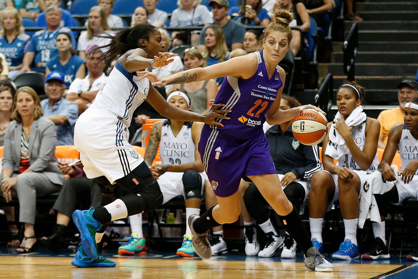 Phoenix Mercury center Cayla Francis (22) drives the ball around Minnesota Lynx forward Devereaux Peters.