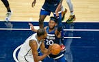 Timberwolves forward Josh Okogie defends against Brooklyn forward Kevin Durant&nbsp;during the second half on April 13.