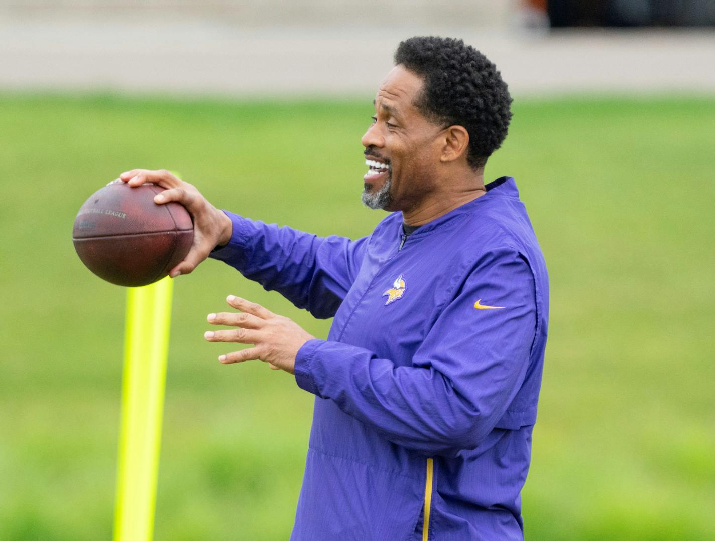 Minnesota Vikings wide receivers coach Keenan McCardell chats with other coaches during Vikings Mini Camp Tuesday, June 7, 2022 at TCO Performance Center in Eagan, Minn. ]
