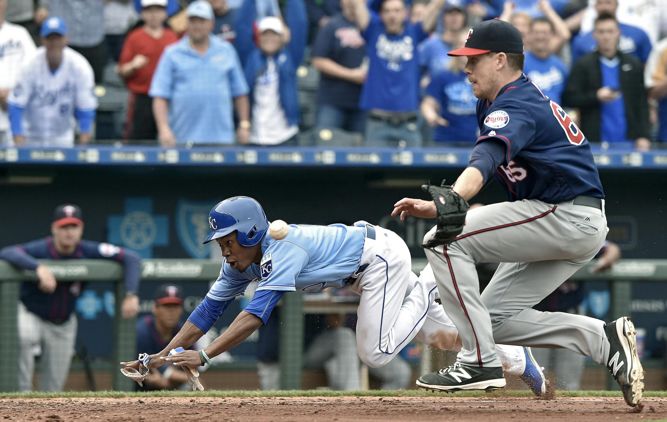 Kansas City Royals' Terrance Gore scores on a wild pitch from Minnesota Twins relief pitcher Trevor May during the tenth inning on Sunday, April 10, 2016, at Kauffman Stadium in Kansas City, Mo. (John Sleezer/Kansas City Star/TNS) ORG XMIT: 1183170
