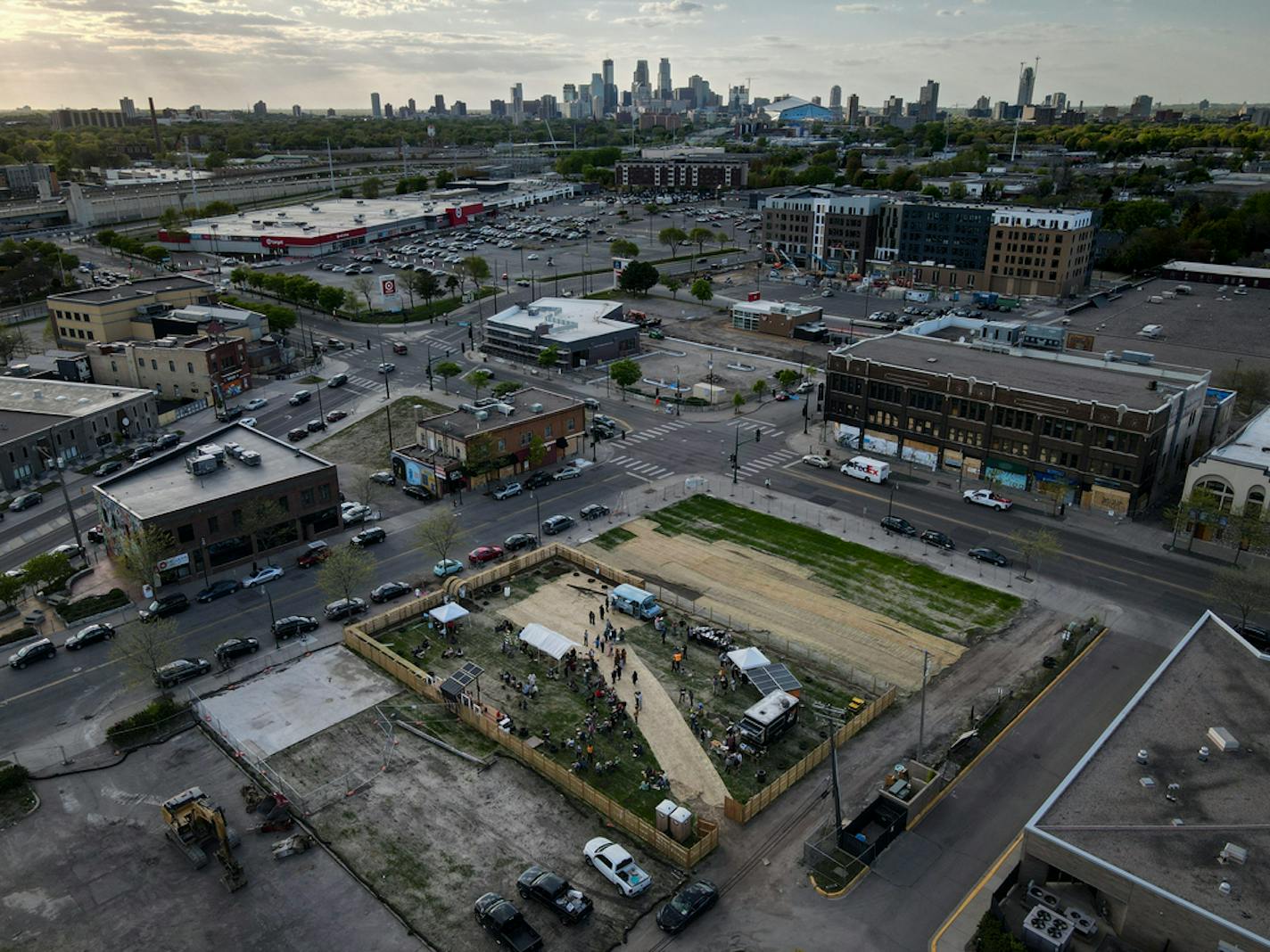 The view looking toward downtown Minneapolis near Lake and Hiawatha, where a substantial number of businesses were burned to the following the murder of George Floyd last May. A crowd was gathered for an Eid-al Fitr celebration at the location of the former Gandhi Mahal Thursday night.