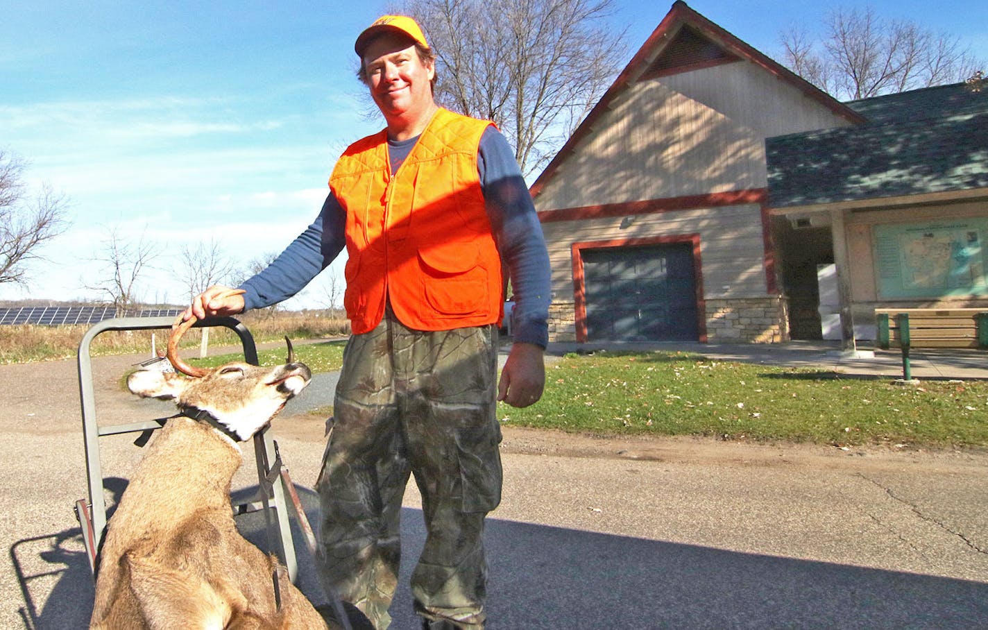 Dan Bonneson of Cottage Grove with the 7-point buck he shot Saturday morning during a special hunt at William O'Brien State Park. Bonneson said it was his third consecutive buck in as many years harvested at the state park. Photo by Tony Kennedy