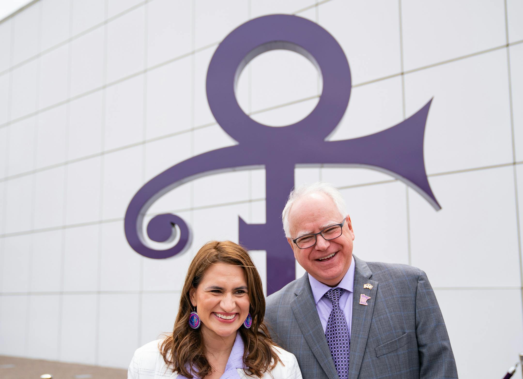 Minnesota Lieutenant Governor Peggy Flanagan and Governor Tim Walz pose for a photo after Walz signed a bill renaming a 7-mile stretch of Highway 5 as "Prince Rogers Nelson Memorial Highway."