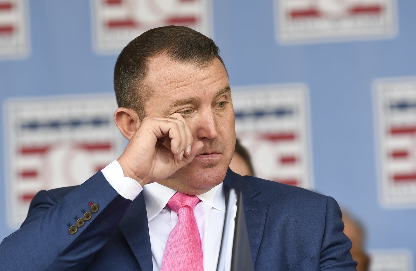 National Baseball Hall of Fame inductee Jim Thome, reacts as his daugter Lila Thome sings the national anthem during an induction ceremony at the Clark Sports Center on Sunday, July 29, 2018, in Cooperstown, N.Y. (AP Photo/Hans Pennink) ORG XMIT: NYHP171