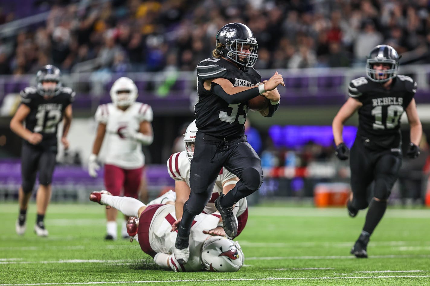 Dilworth-Glydon Felton running back Nicholas Waale breaks free from a defender and scores a late fourth quarter touchdown for the Rebels. (Brennan Schachtner, Special to the Star Tribune)&nbsp;