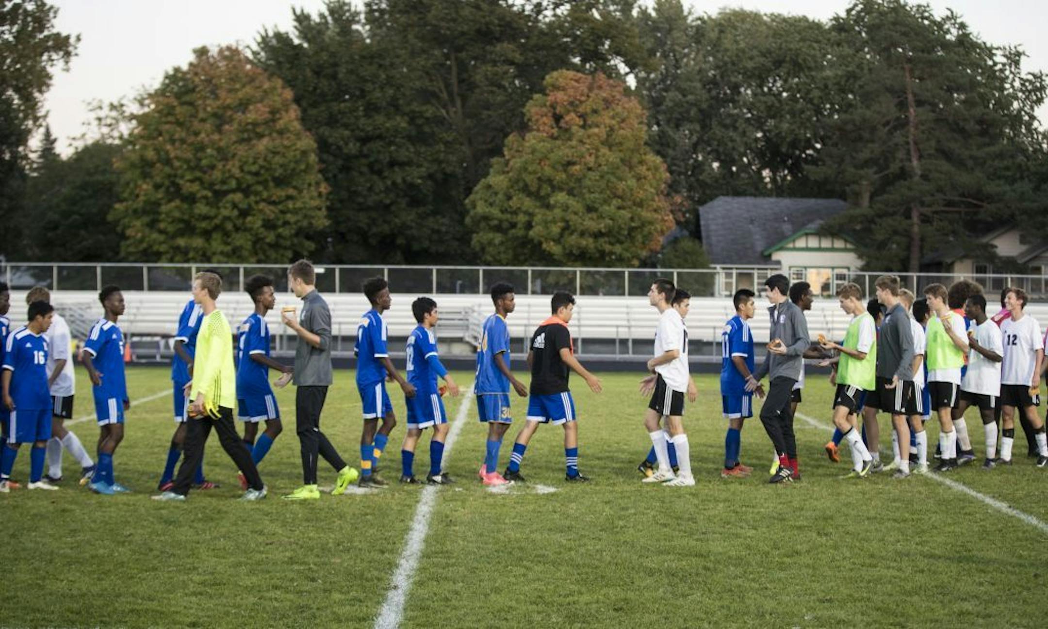 Players shook hands after a boy's soccer game between Edison High School (blue jerseys) and Southwest High School (white jerseys) on Wednesday, September 27, 2017 at Southwest High School in Minneapolis, Minn.