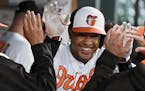 The Baltimore Orioles' Jonathan Schoop celebrates in the dugout after his solo home run against the Seattle Mariners in the first inning at Oriole Par