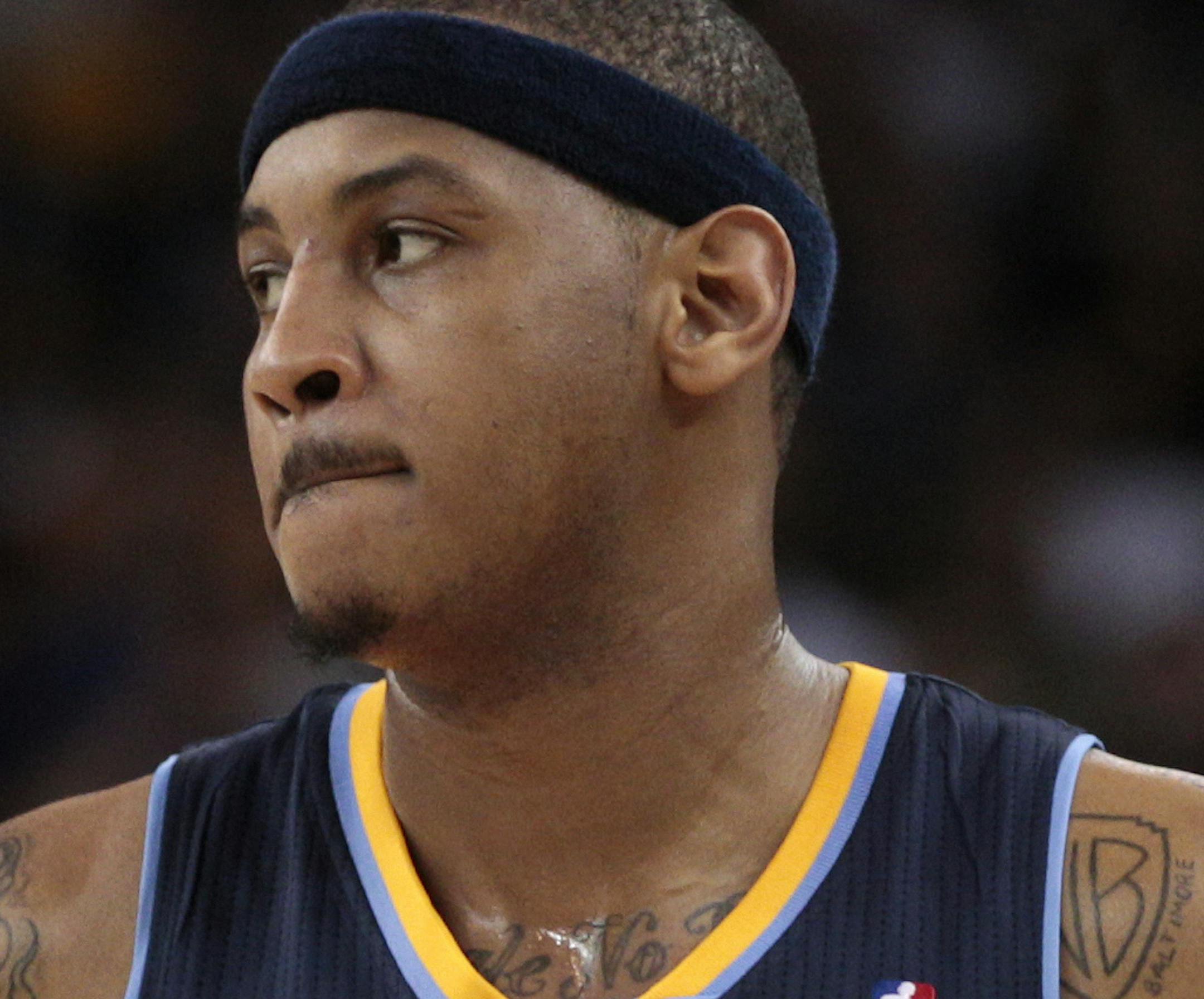 Denver Nuggets small forward Carmelo Anthony (15) against the Golden State Warriors in an NBA basketball game in Oakland, Calif., Wednesday, Feb. 9, 2011. (AP Photo) ORG XMIT: NYOTK