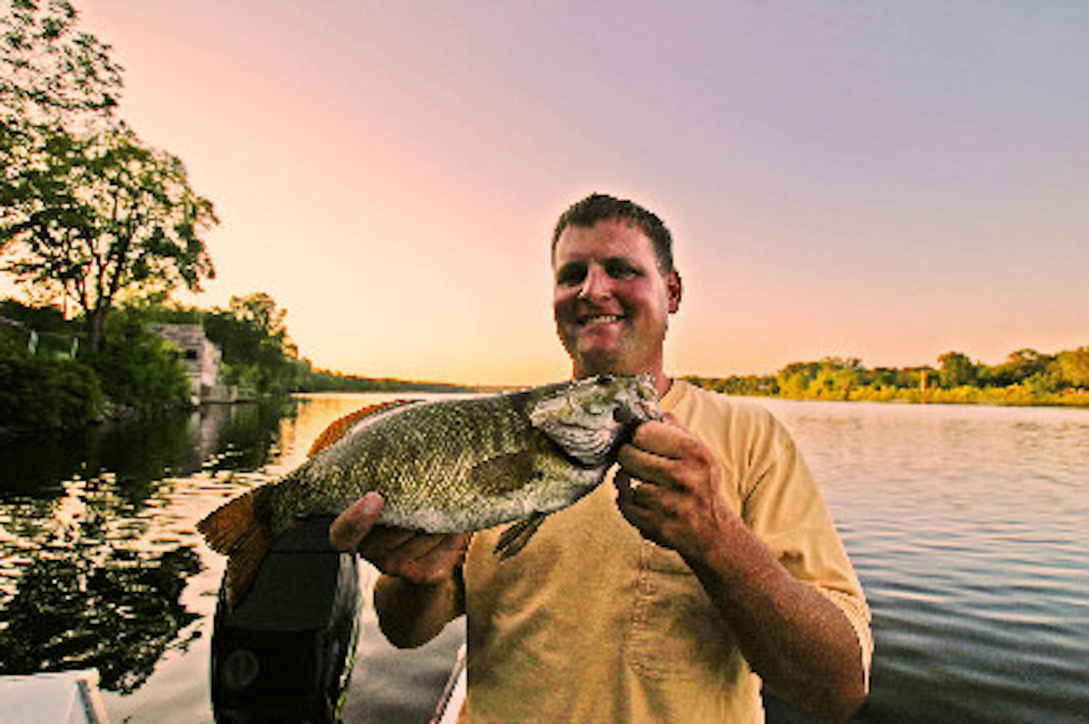 Mark Westerman with a late August smallmouth and plenty of beautiful scenery
