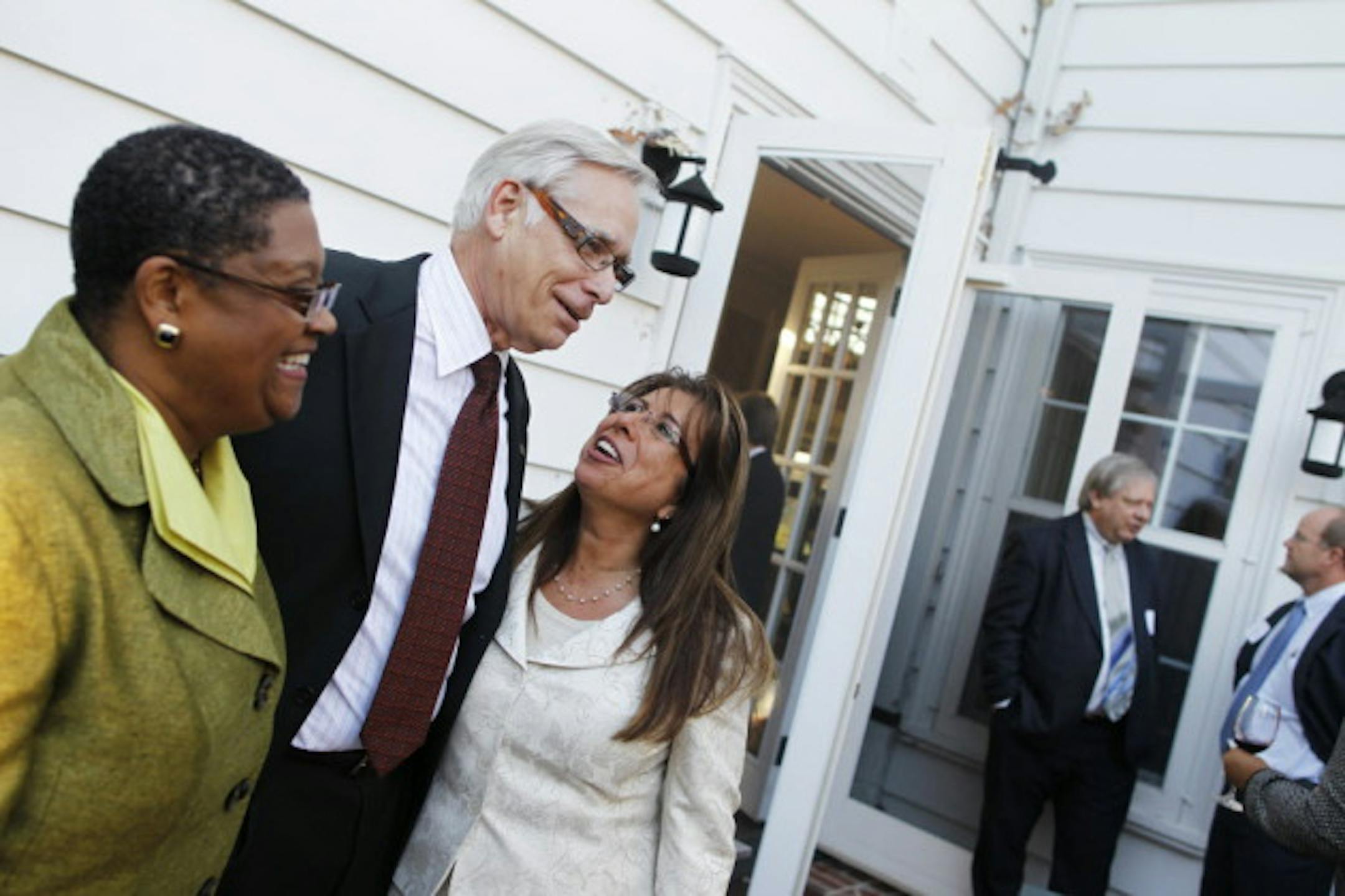 Superintendents Bernadeia Johnson of Minneapolis, left, and Valeria Silva of St. Paul, right, shown here with Robert Bruininks, couldn't get hired in each other's districts.