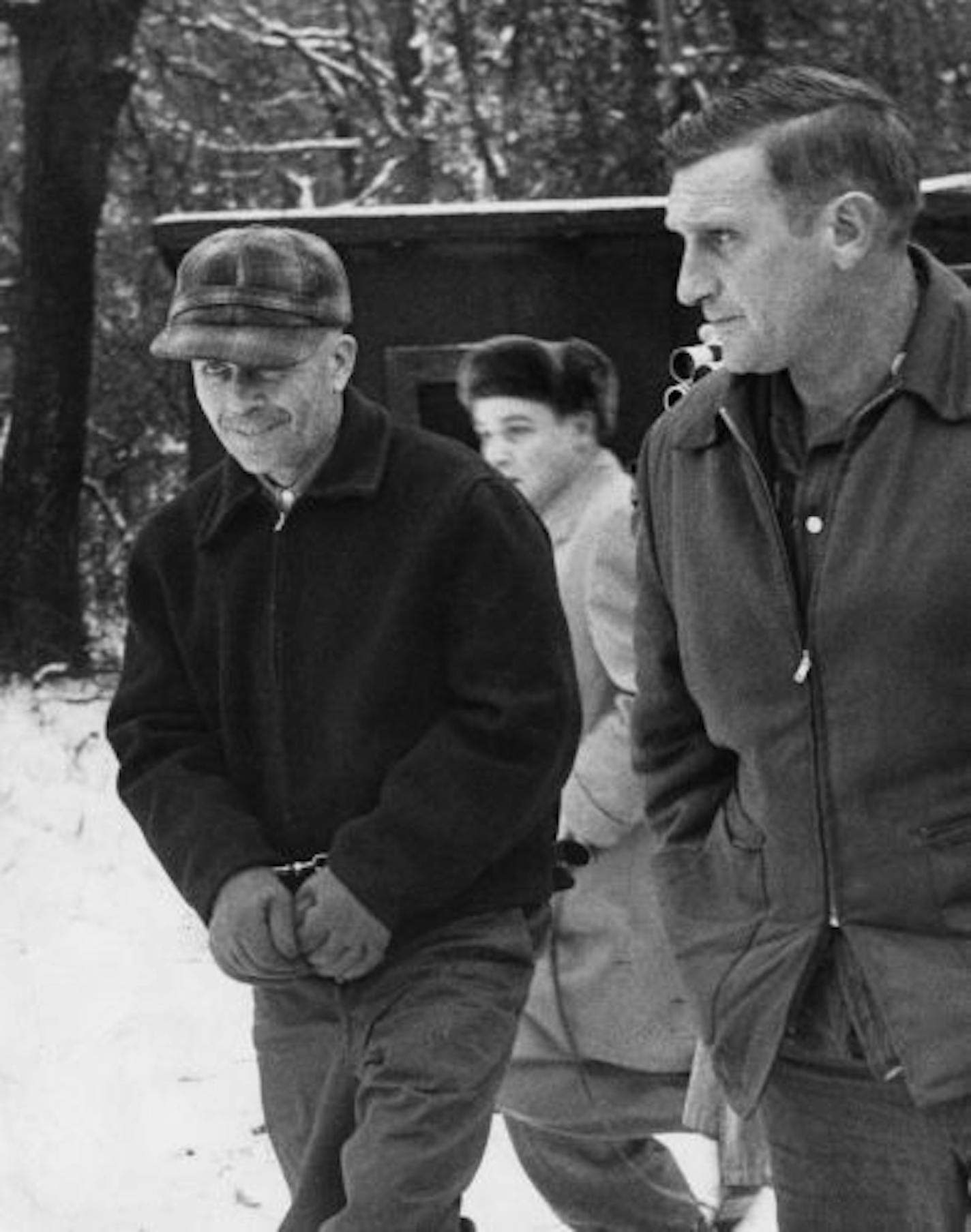 Ed Gein, a Wisconsin, was led away by Sheriff Arthur Schley, near Plainfield, Wis., in 1957, after he admitted to murdering two women and robbing graves.