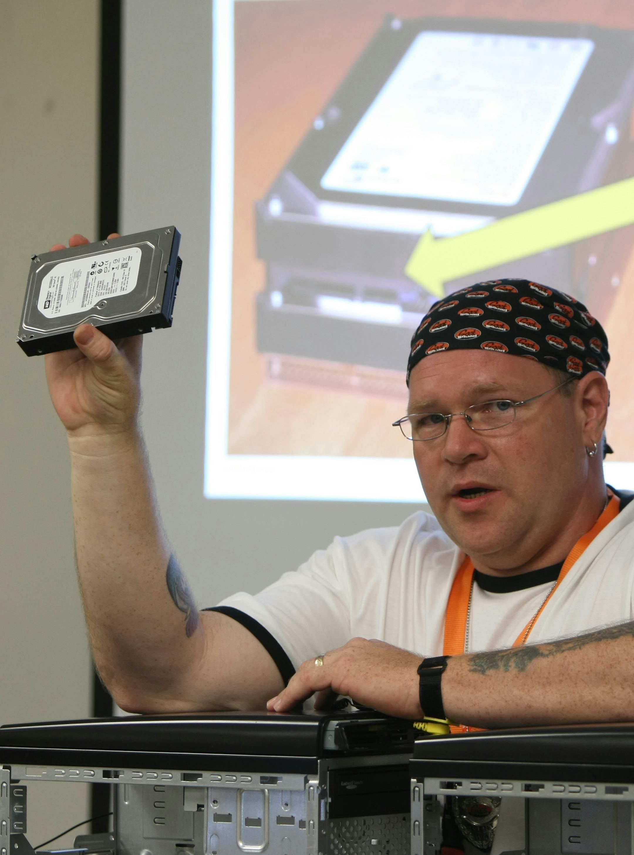 Geek Squad's Ed Dean explained the different types of hard drives to girls at a different kind of summer camp. Students will reassemble PCs and finish their websites today and Wednesday.