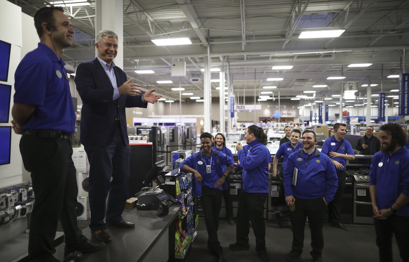 Best Buy Ridgedale manager Brian Maciej, left, shared a countertop stage with Best Buy CEO Hubert Joly as they gave a final pep talk to employees of the store 10 minutes before the doors opened to shoppers. ] JEFF WHEELER &#x2022; jeff.wheeler@startribune.com Best Buy CEO Hubert Joly rallied the team at the company's Ridgedale store ahead of opening the doors for early Black Friday shopping Thanksgiving evening, November 23, 2017 in Minnetonka.