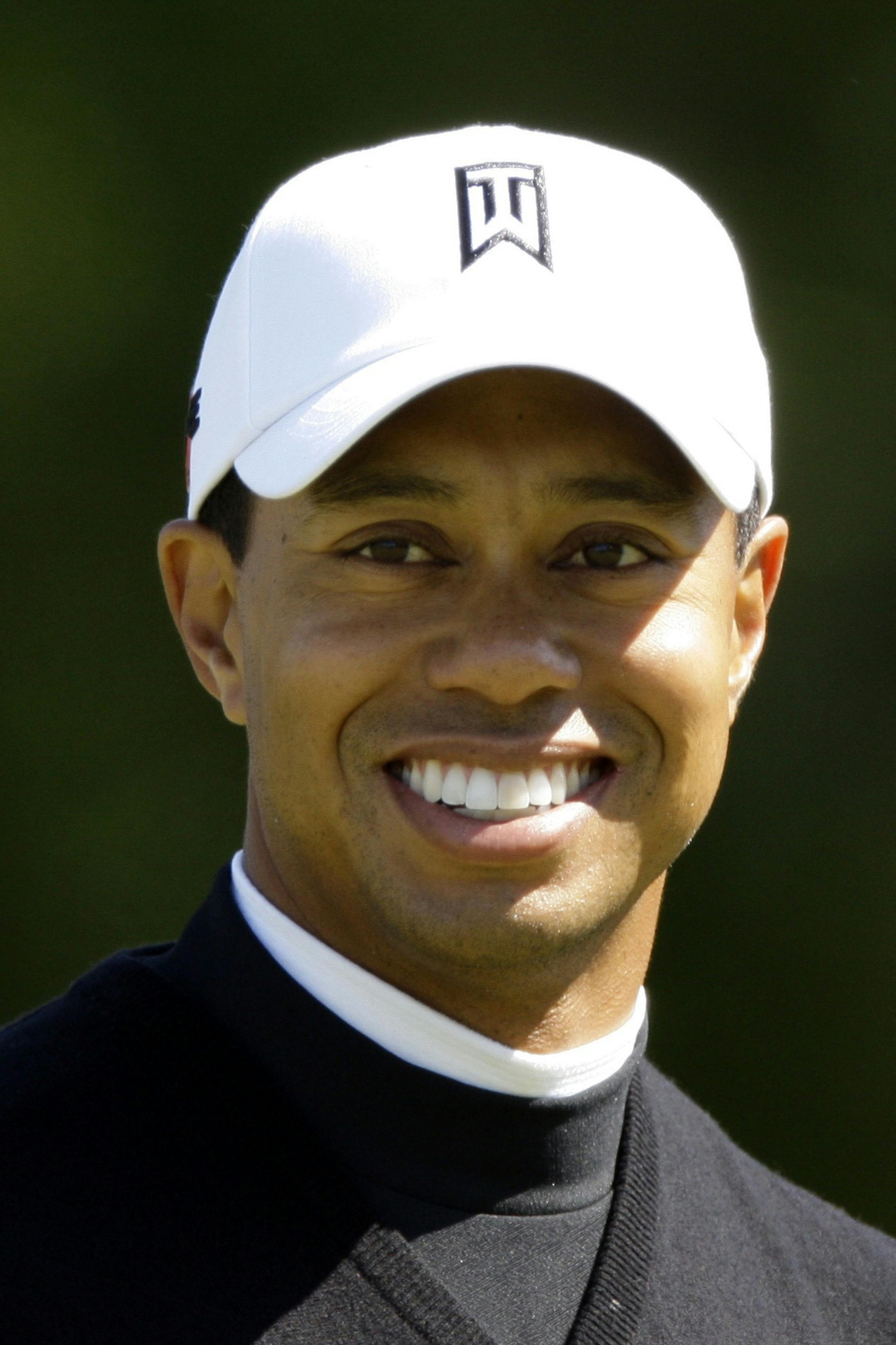 FILE - In this April 8, 2009, file photo, Tiger Woods smiles during his practice round for the Masters golf tournament at the Augusta National Golf Club in Augusta, Ga. Woods is scheduled to hold his first press conference in nearly five months at 2 p.m. on Monday, April 5, according to a tentative interview schedule that Augusta National released Wednesday March 24, 2010. (AP Photo/Charlie Riedel, File) ORG XMIT: NY147