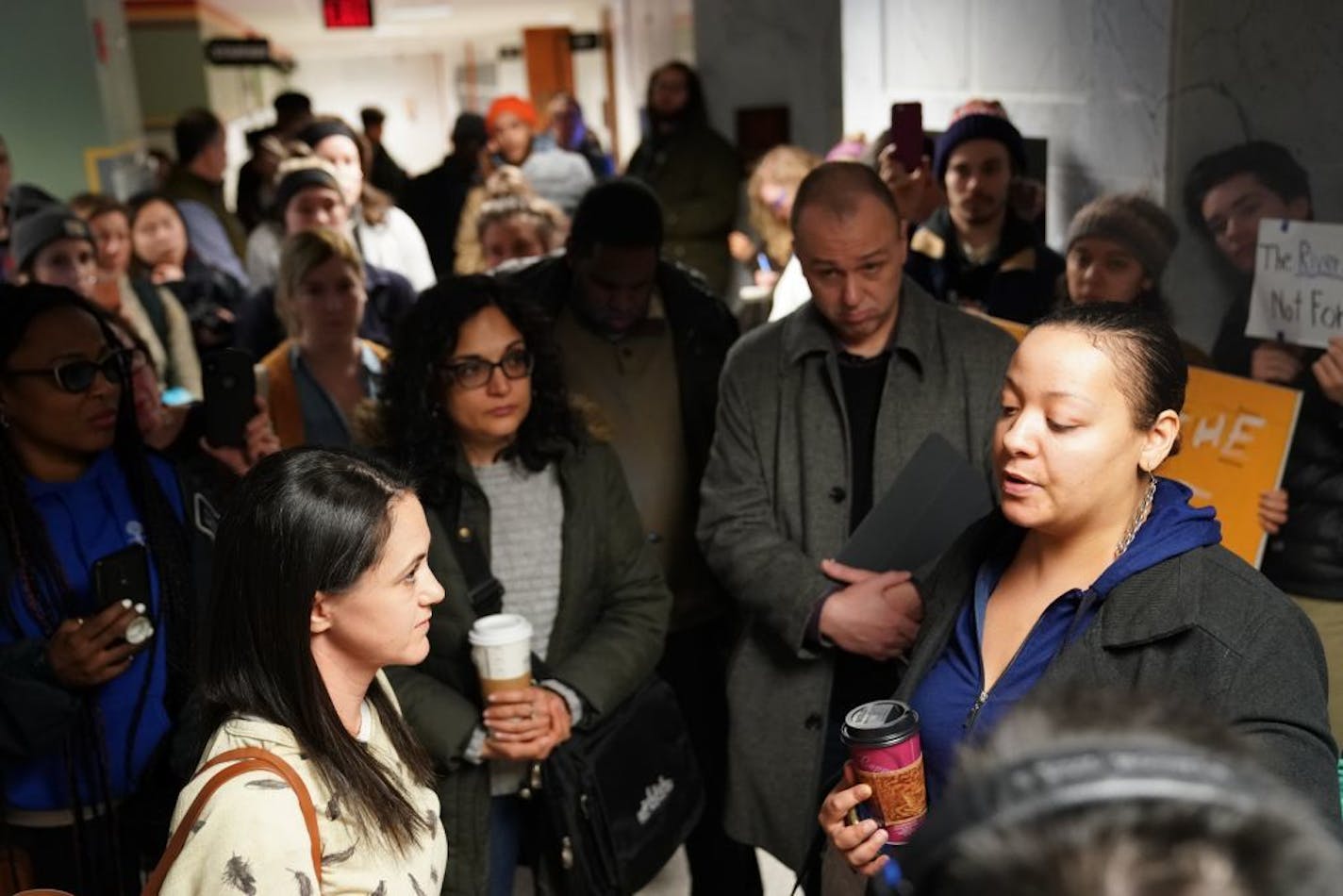 Roxxanne O'Brien, right, of the Environmental Justice Coordinating Council, voiced shared frustrations in the Upper Harbor Terminal plan to First Avenue owner Dayna Frank.