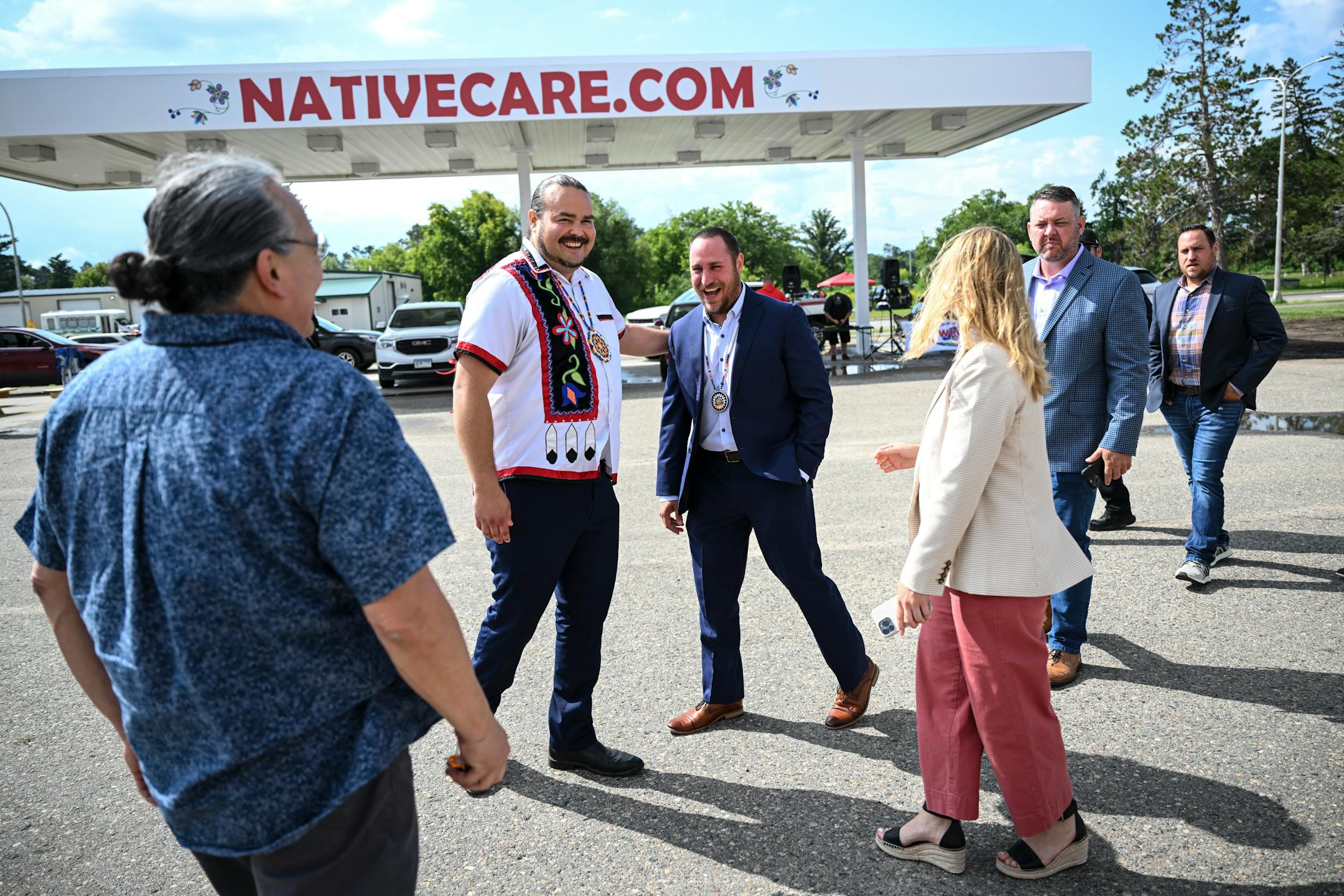Red Lake National Tribal Secretary Samuel Strong, left of center, greets Grant Johnson, a tribal administrator with the Prairie Island Indian Community Tuesday, Aug. 1, 2023 at NativeCare  in Red Lake, Minn. The Red Lake Nation opened the state's first recreational marijuana dispensary Tuesday morning. Government relations workers, legal counsel and administrators traveled from Prairie Island to support Red Lake's recreational cannabis sales efforts.