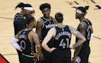 Minnesota Timberwolves forward Anthony Edwards and teammates huddle as time runs down during the fourth quarter of the team's win over Houston.