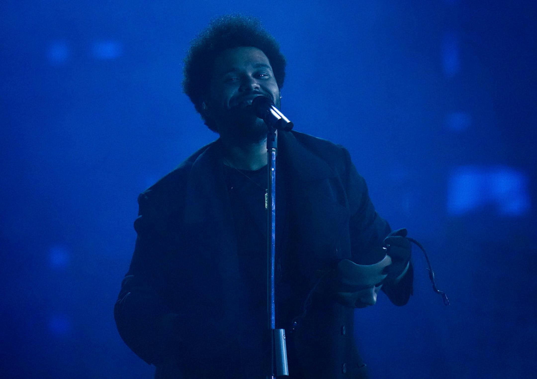 The Weeknd performs in Vancouver, British Columbia on Aug. 23, 2022. The Weeknd suddenly ended his sold-out concert in Southern California after losing his voice during a mid-song performance. The four-time Grammy winner was performing his third song "Can't Feel My Face" before he abruptly stopped his show Saturday, Sept. 3, 2022 at SoFi Stadium in Inglewood, Calif. (Darryl Dyck/The Canadian Press via AP)